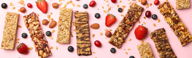 istock Tasty granola bars on pink background, top view 1271467209