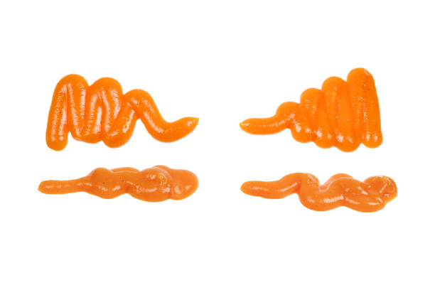 istock Orange sauce splashes isolated on white background 1271467625