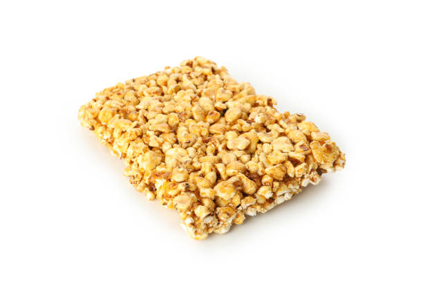 istock Tasty peanut brittle isolated on white background 1271467663