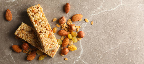 istock Tasty granola bars on gray background, top view 1271467711