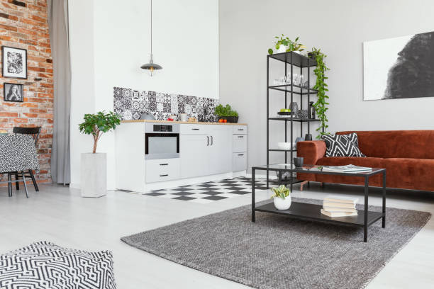 istock Open space studio apartment with kitchen and living area 1271468668