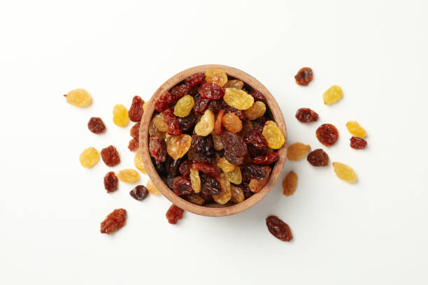 istock Bowl with raisins on white background, top view 1271469523