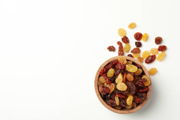 istock Bowl with raisins on white background, top view 1271470431