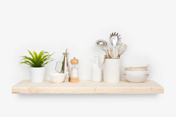 istock Kitchen utensils, flower pot and dishware on natural wooden shelf 1271470638