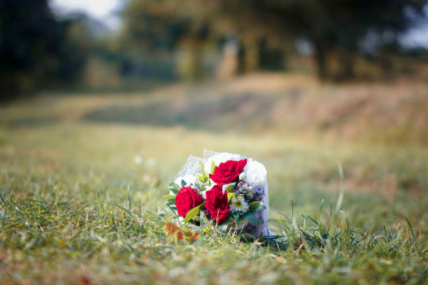 a wedding bouquet of flowers for the bride lies on the green lawn