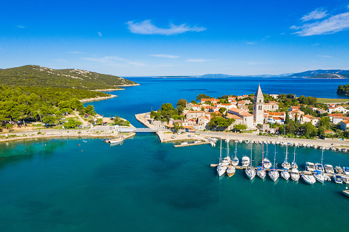 Beautiful old historic town of Osor, marina and bridge connecting islands Cres and Losinj, Croatia, aerial view from drone