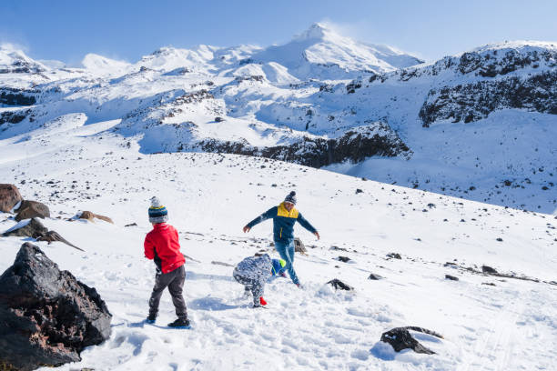 istock Father with kids playing with snow. 1271471769