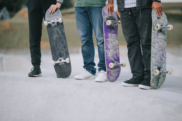 istock Asian skateboarders standing  at skateboard park 1271473176