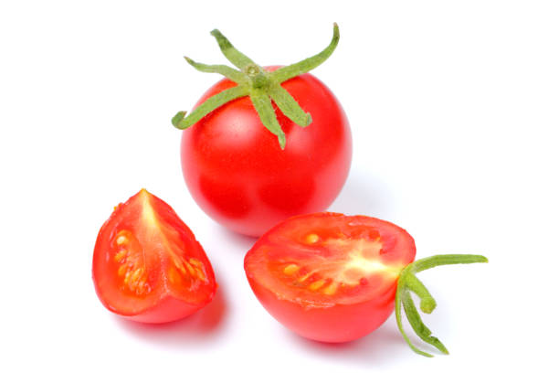 istock Fresh organic tomato with halves on a white background, bright natural color, 1271473375