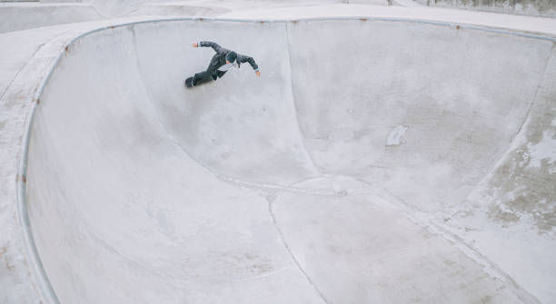 istock Asian skateboarder in action 1271474088