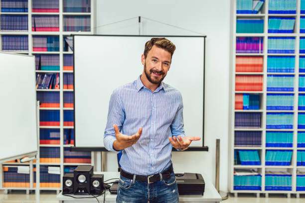 istock Male coach giving presentation for audience in lecture hall 1271474266