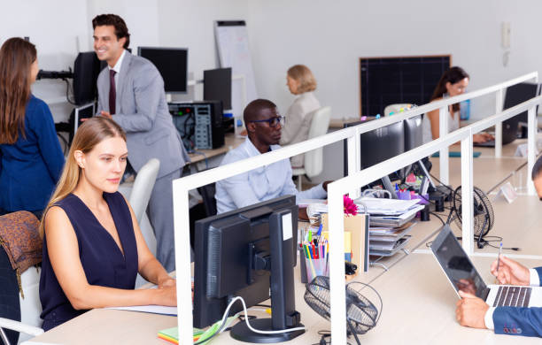 istock Multiracial group of successful business people during daily work in modern co-working space 1271479800