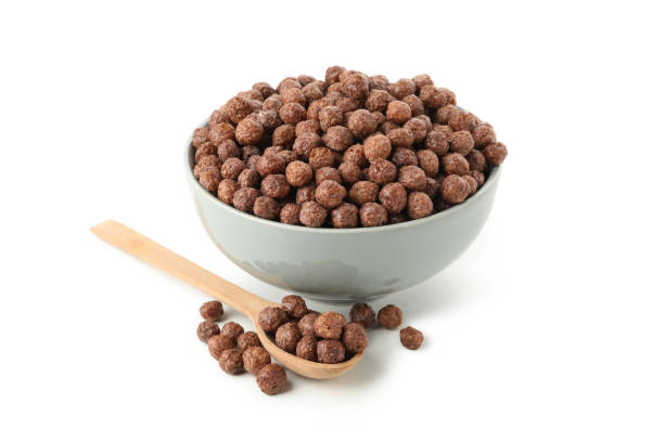 istock Bowl and spoon with corn balls isolated on white background 1271480048