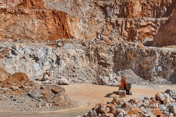 istock Heavy excavator on a quarry. Excavation machinery. Earthmover work 1271480973