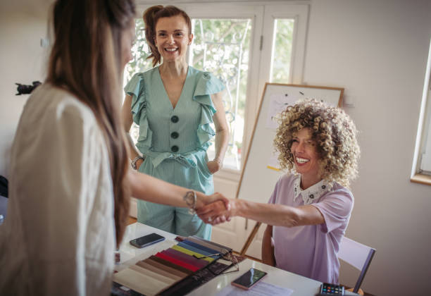 istock Group of young business people working and communicating while sitting 1271482654