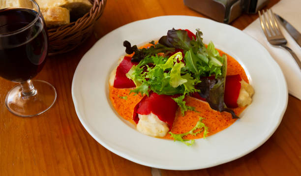 istock Stuffed piquillo peppers  with  cod brandade in sauce 1271482994