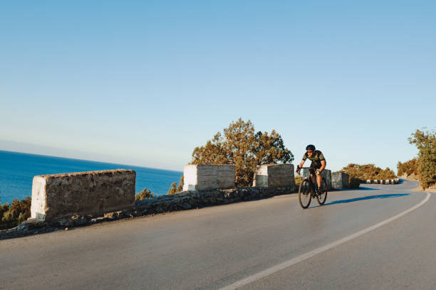 istock Cyclist riding on his bicycle at coastal road 1271487561