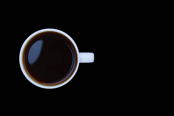istock White cup with a black coffee without foam. Black background. 1271487818