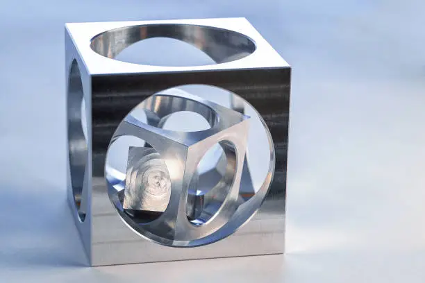 Cube in cube, produced on a modern five-axis CNC milling machine.