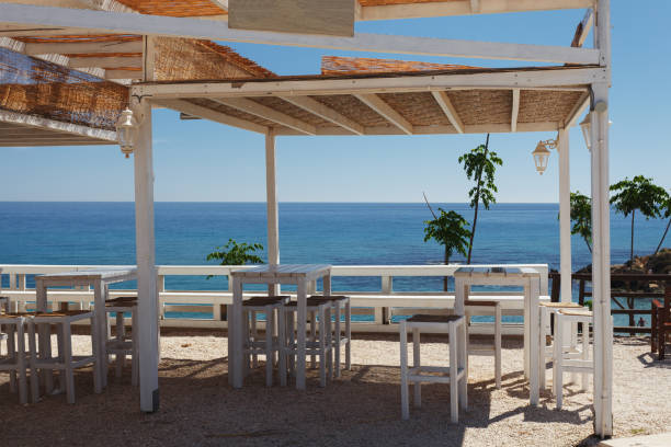 istock White gazebo with tables and chairs overlooking the Mediterranean sea 1271489792