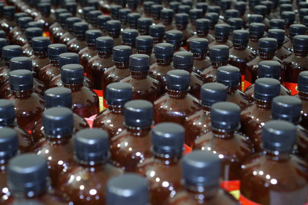 istock Arrangement of black plastic bottles 1271492713