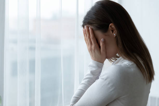 istock Desperate stressed woman hiding face in hands, suffering from depression. 1271492822