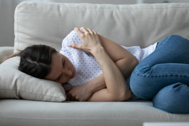 istock Stressed young woman lying on sofa suffering from depression. 1271492954