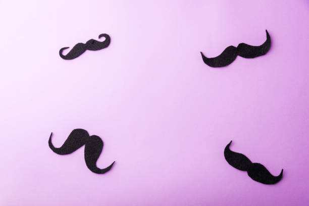 istock Black mustache paper on purple 1271496299