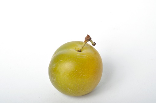 Reine Claude plums on a white background