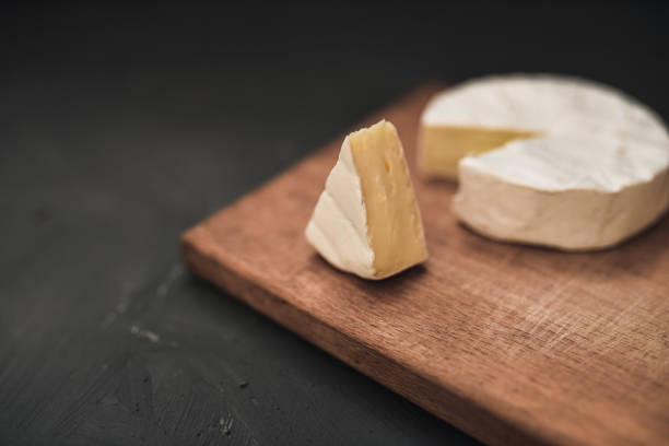 istock cheese camembert with mold on cutting board 1271497175