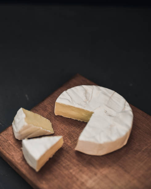 istock cheese camembert with mold on cutting board 1271498470