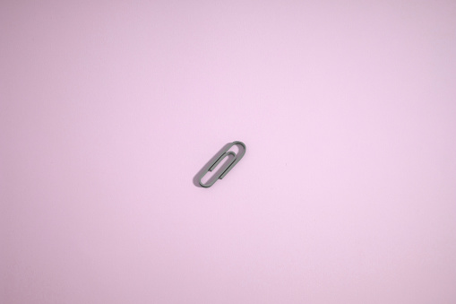Clip icon in a pink background. 3D rendering.