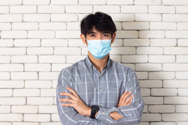 istock young man wearing a mask 1271500310