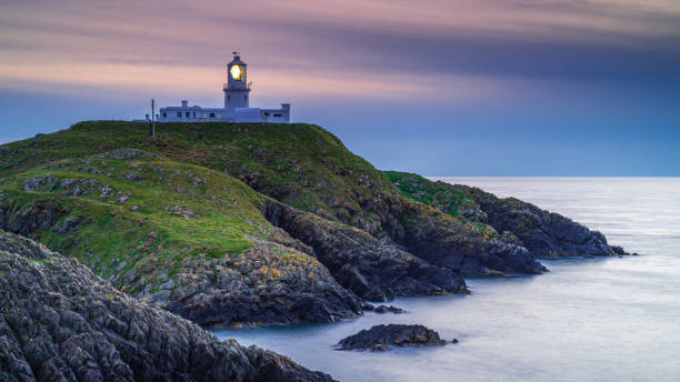 istock Strumble Head Lighthouse, Pembrokeshire, at sunset 1271501816