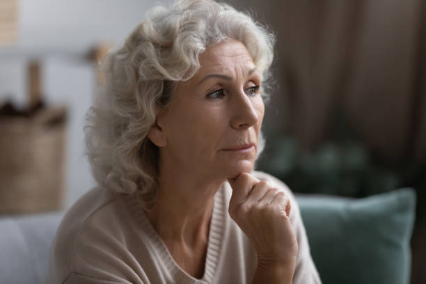 istock Close up thoughtful middle aged woman looking to aside 1271502112