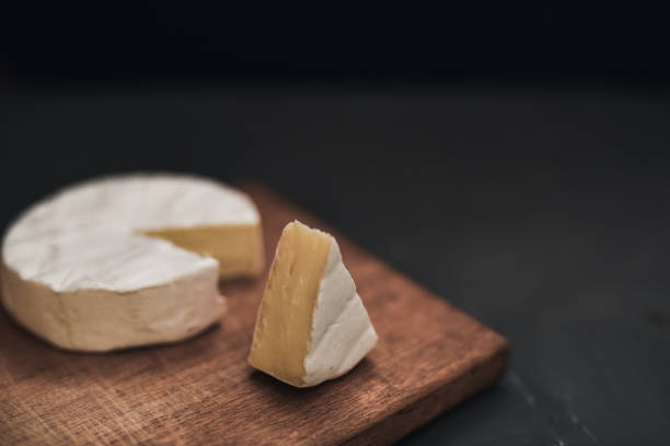 istock cheese camembert with mold on cutting board 1271503372