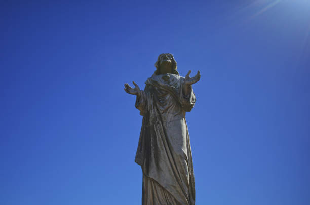 istock Old stone catholic Jesus Christ statue Brisbane cemetery 1271503675
