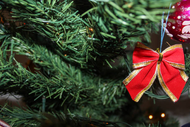 istock Christmas time. The artificial Christmas tree is decorated with Christmas decorations and Christmas light garlands. 1271503709
