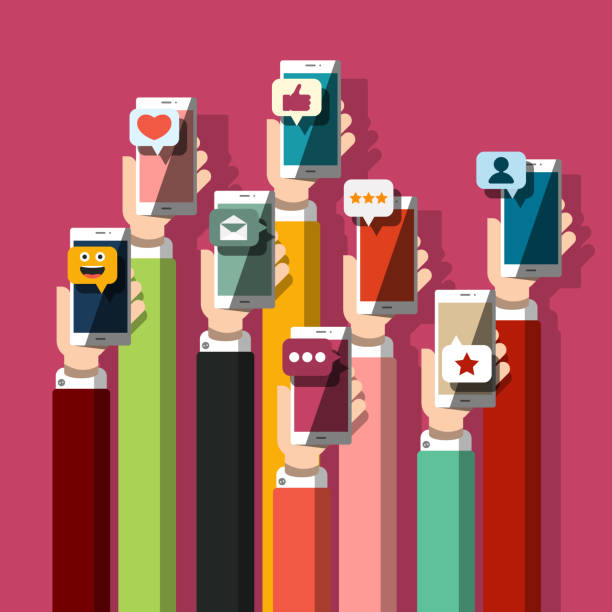 istock Hands Holding Mobile Phones with Social Media Icons 1271506370