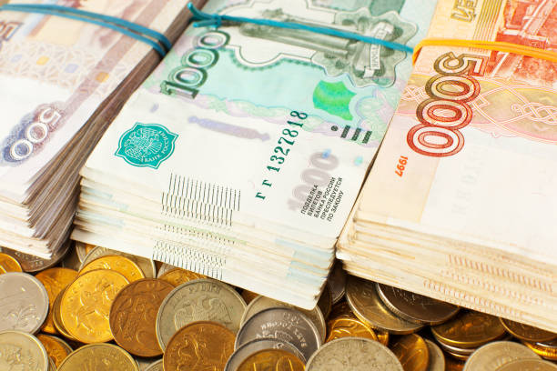 istock Russian rubles - stacks of banknotes and coins 1271506452