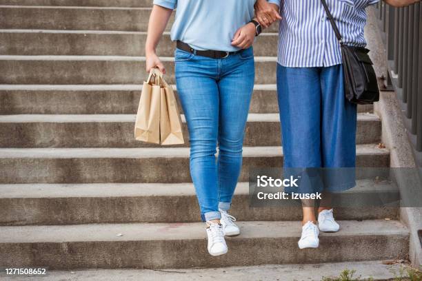 Home Caregiver Helping Senior Woman To Walk Up Stairs Stock Photo - Download Image Now