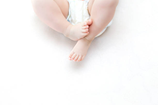 istock Cute baby girl lying on bed 1271508961