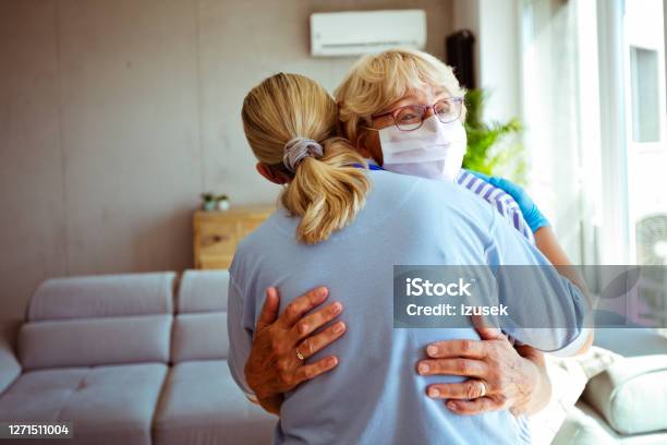Home Caregiver Supporting Senior Woman During Coronavirus Pandemic Stock Photo - Download Image Now