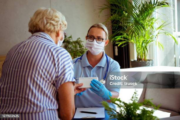 Nurse Talking With Senior Woman During Home Visit Stock Photo - Download Image Now - Diabetes, Doctor, Nurse
