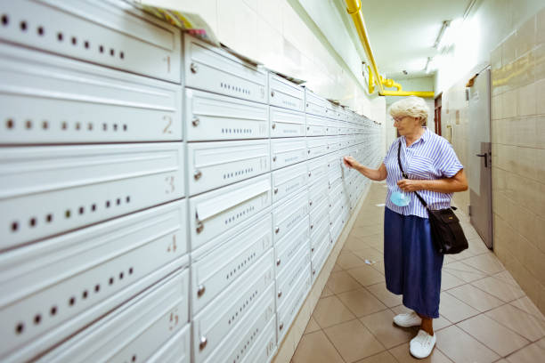 istock Senior woman checking for mailbox 1271512492