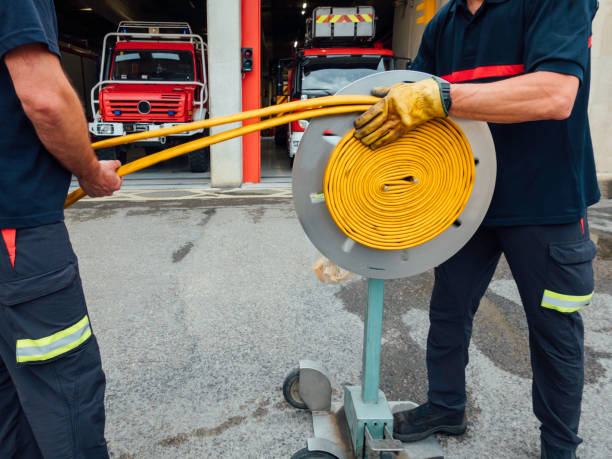istock Folding of fire hoses after washing 1271512759