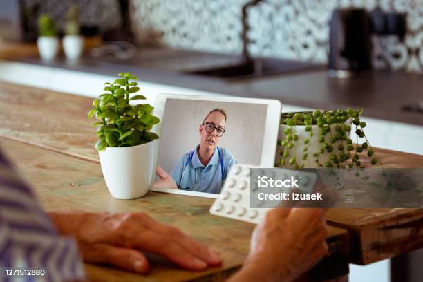 Video Call With Female Doctor During Coronavirus Pandemic Stock Photo - Download Image Now