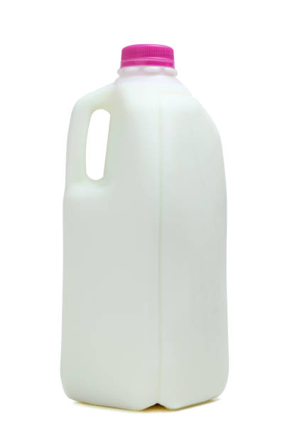 Half gallon of milk Half gallon bottle of milk with pink color cap half full stock pictures, royalty-free photos & images