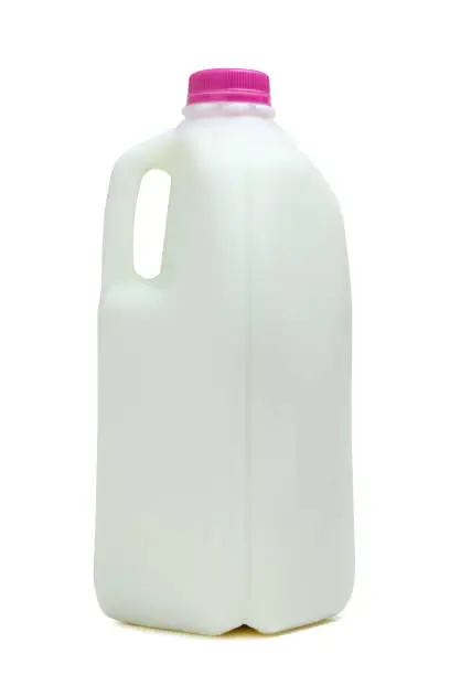 Half gallon bottle of milk with pink color cap