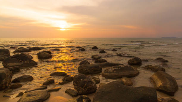istock The beautiful orange sky with the rocks in the foreground 1271514367